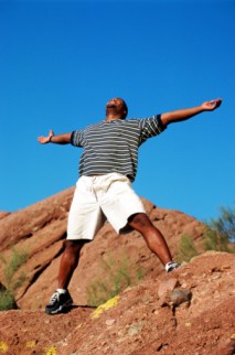 man standing on rock
